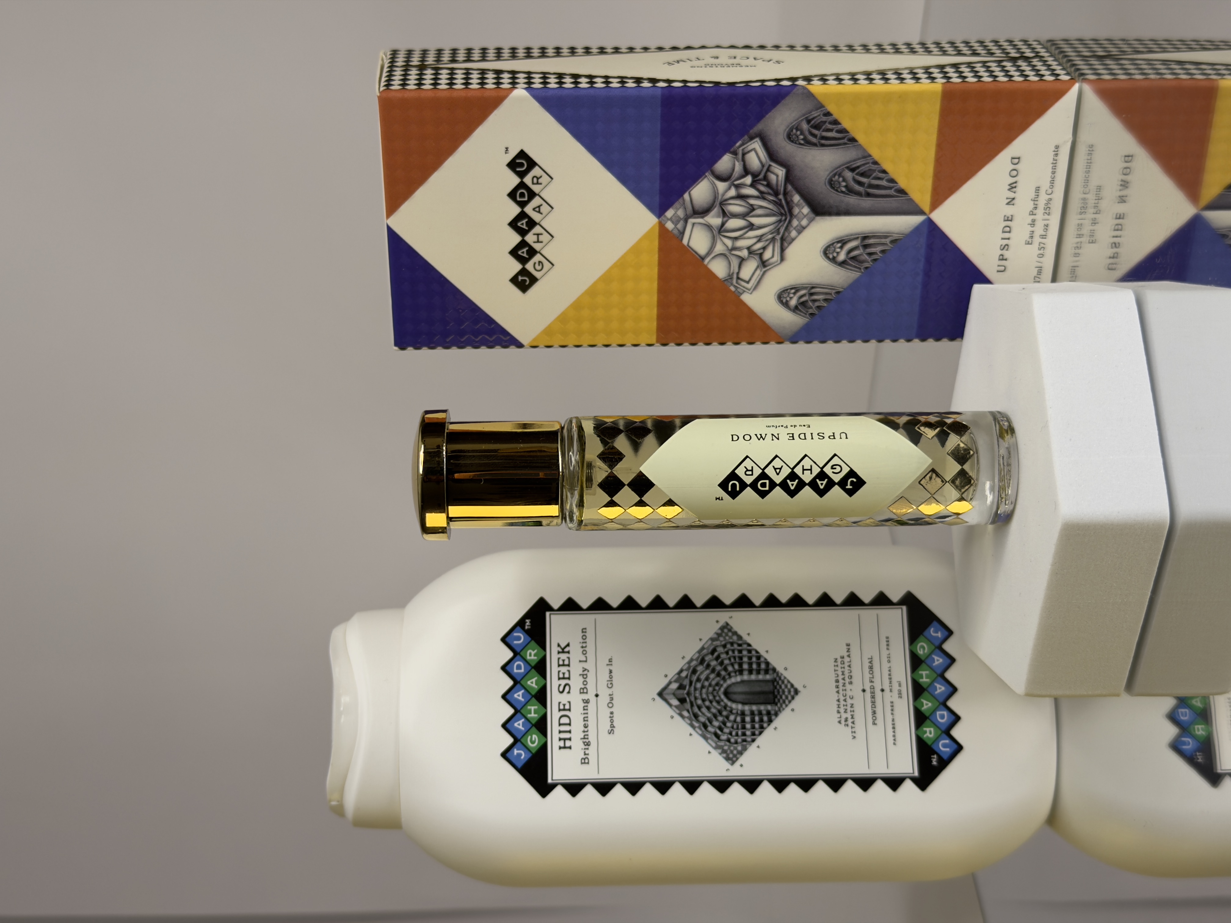 Hide Seek body lotion with Upside Down perfume and its geometric packaging